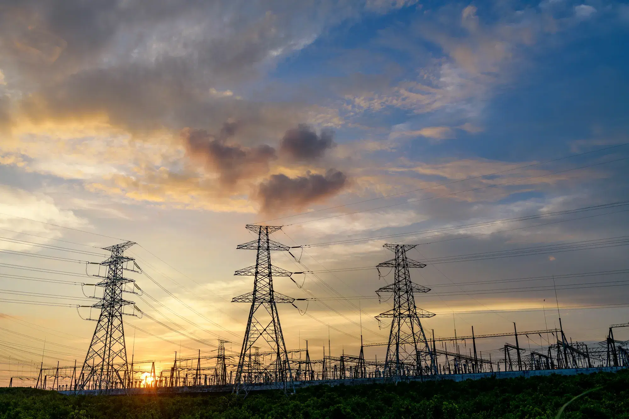 Transmission towers at sunset